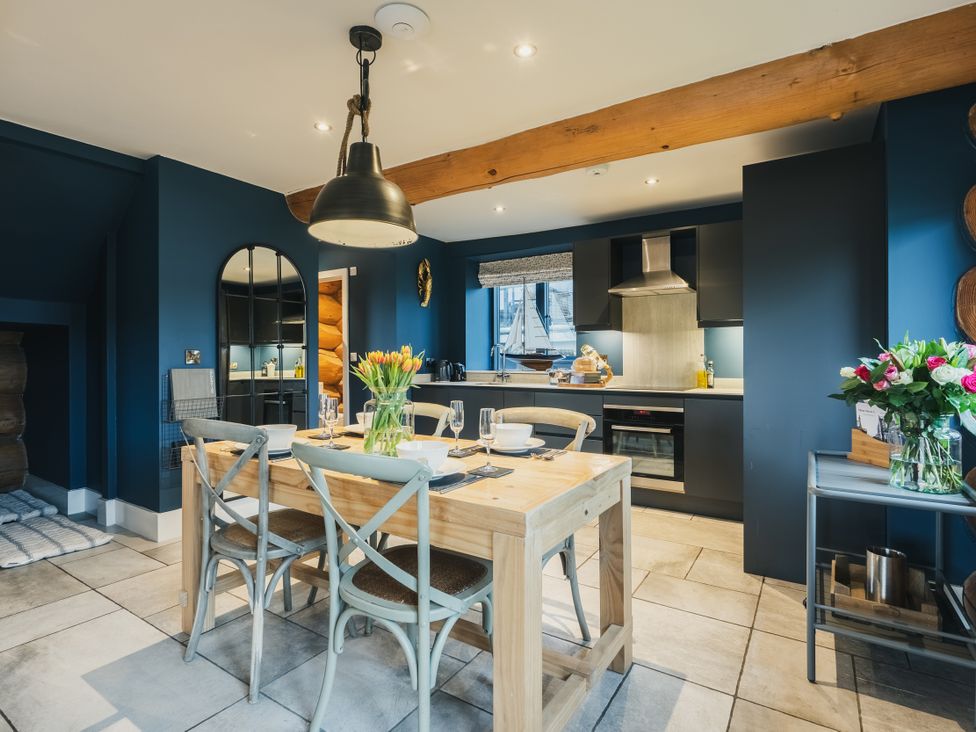 A kitchen with a dining table and chairs at The Lookout in Addingham
