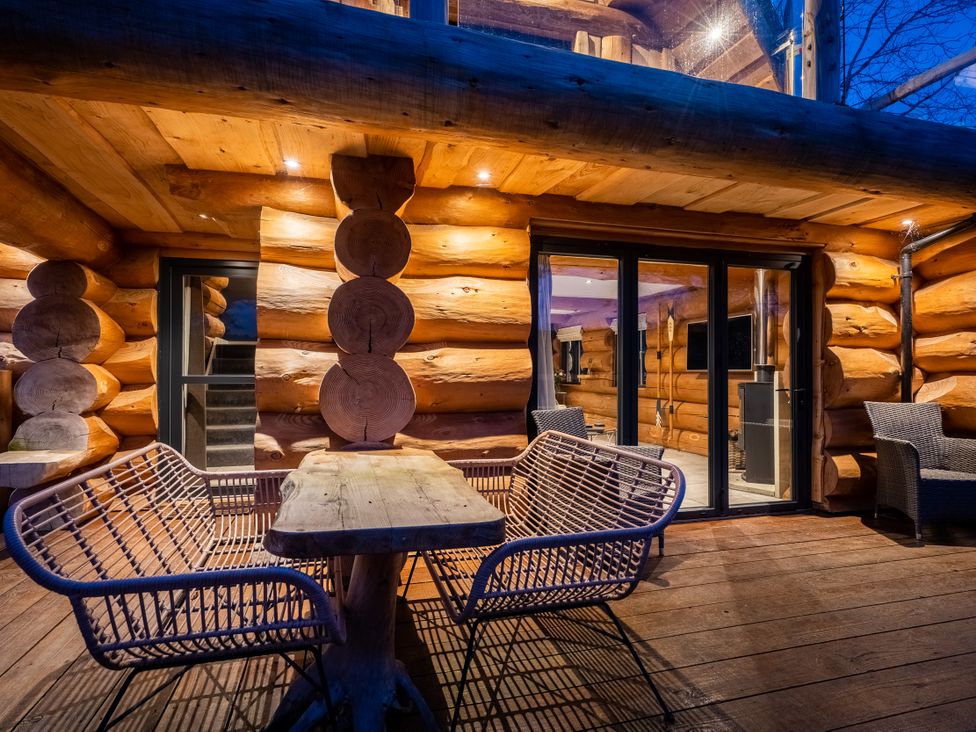 An outdoor seating area with a table and chairs at The Lookout in Addingham