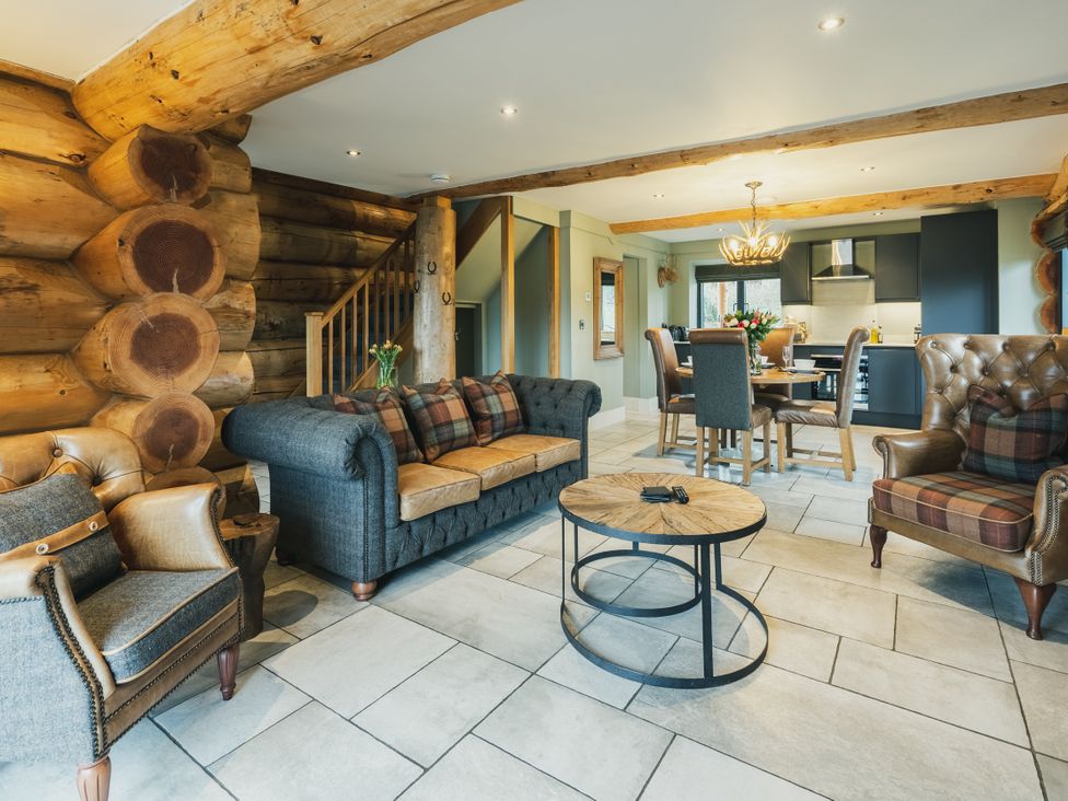 A living room with a sofa and coffee table at Keepers Cabin in Addingham