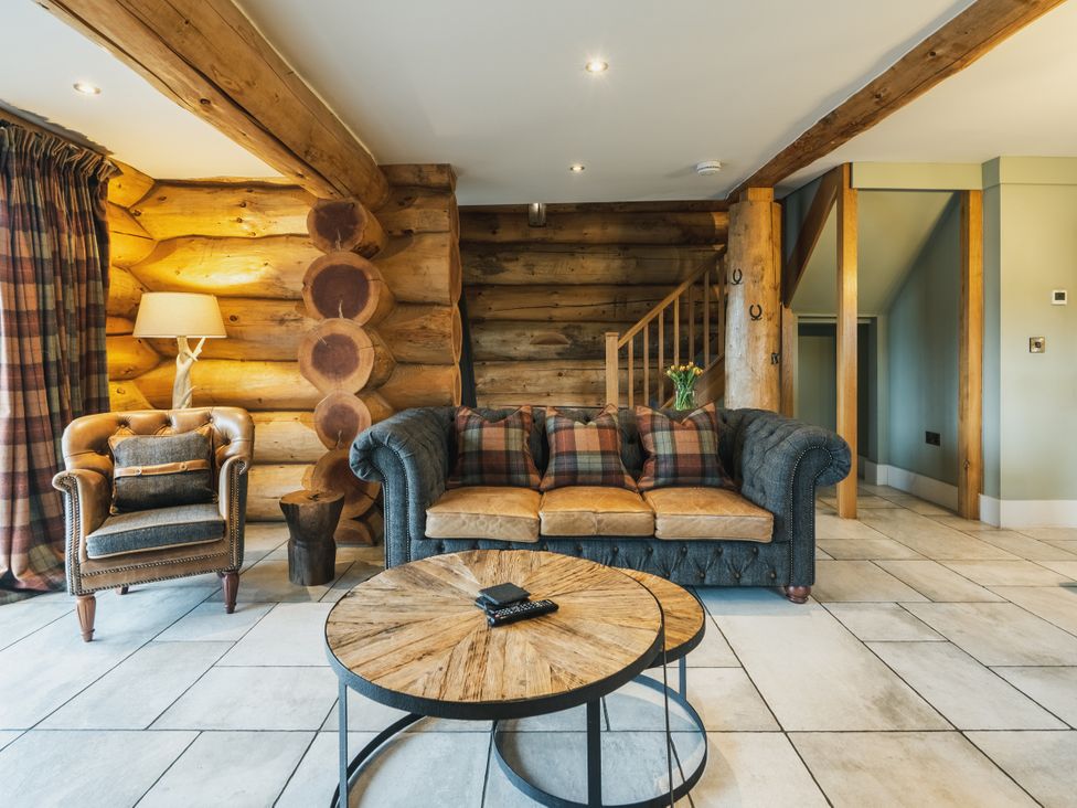 A living room with a sofa and chair at Keepers Cabin in Addingham