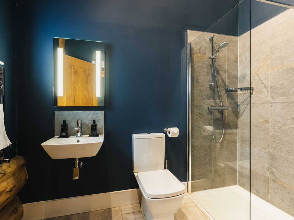 A bathroom with a sink and shower at The Farmhouse in Addingham