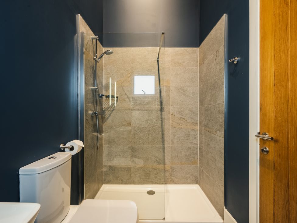 A bathroom with a shower and toilet at The Farmhouse in Addingham