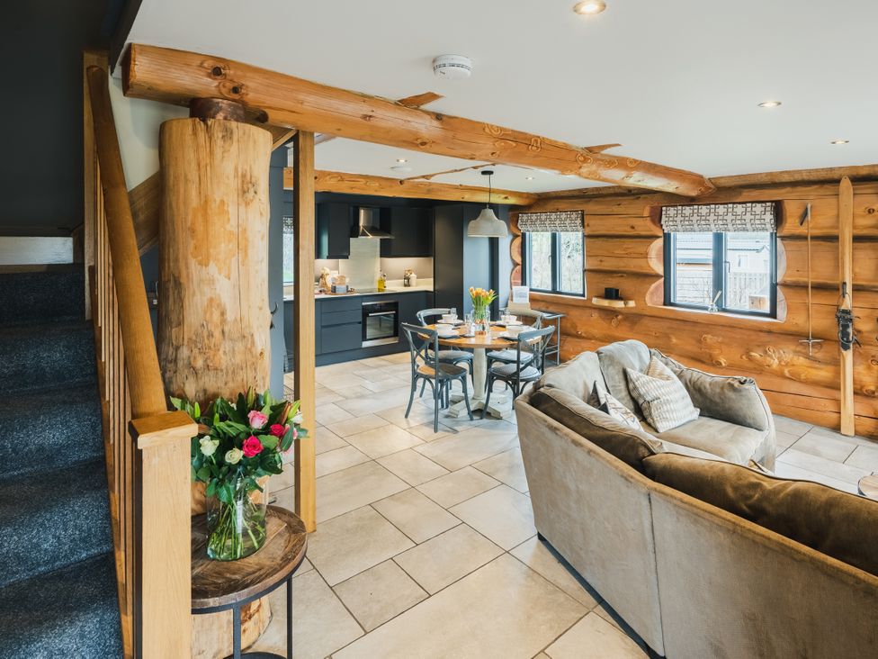 A living room featuring a sofa and dining area at Apres Ski in Addingham