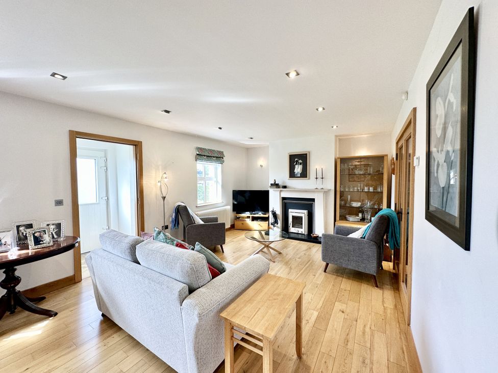 A living room with a sofa and television at Seeview, Charleville
