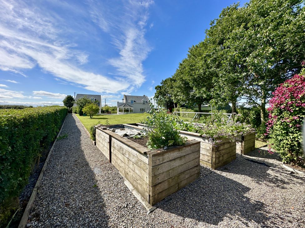 A garden with vegetable beds and a gravel path at Seeview in Charleville