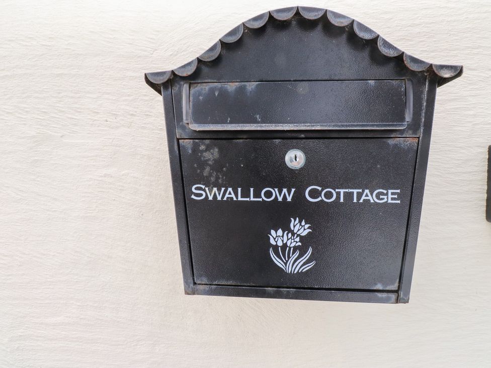 A mailbox with the name Swallow Cottage at Swallow Cottage in Llangefni
