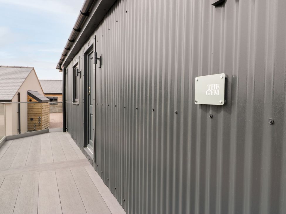 An outdoor area leading to the gym at Bell House in Llanfechell