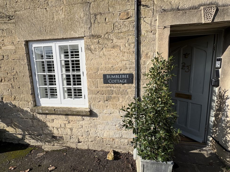 A window and door at Bumble Bee Cottage in Tetbury