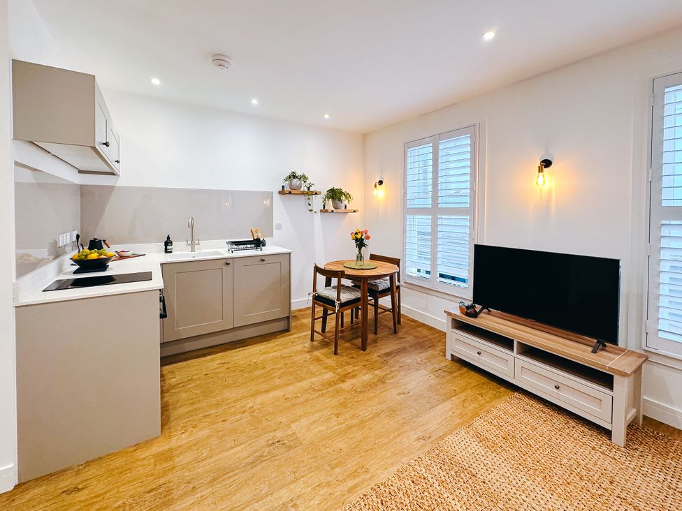 A kitchen with a table and chairs at Ammil Bespoke 