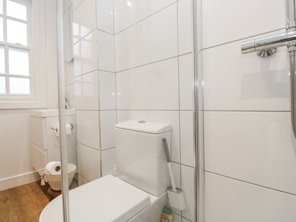 A bathroom with a toilet and shower at Ammil Bespoke in St Ives