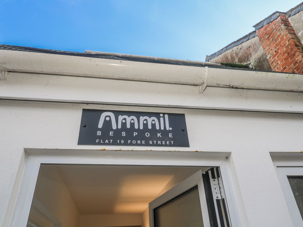 A sign for Ammil Bespoke at the entrance of a flat in St Ives