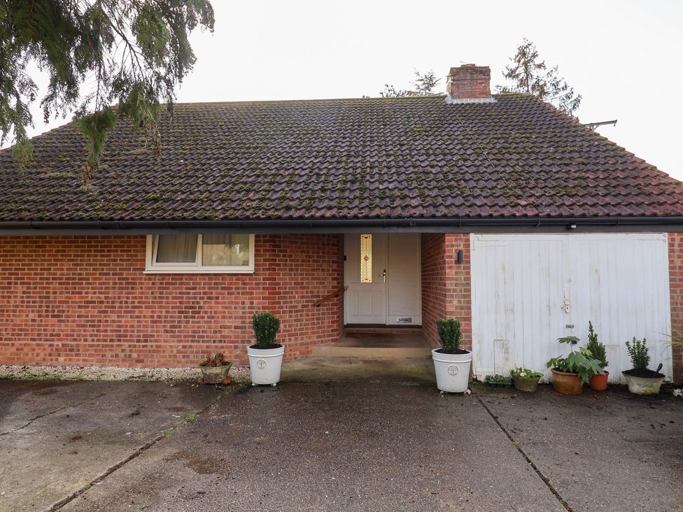 A house with a front door and garage at Three Ways South Lopham near Garboldisham