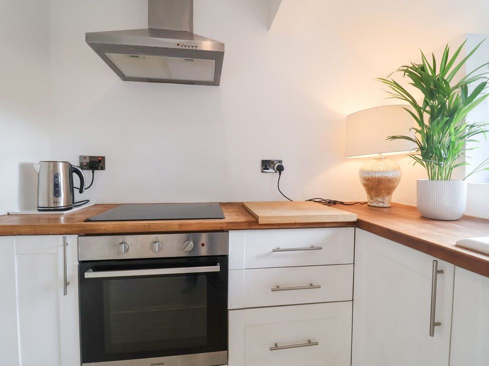 A kitchen with a cooker and kettle at Three Ways South Lopham near Garboldisham