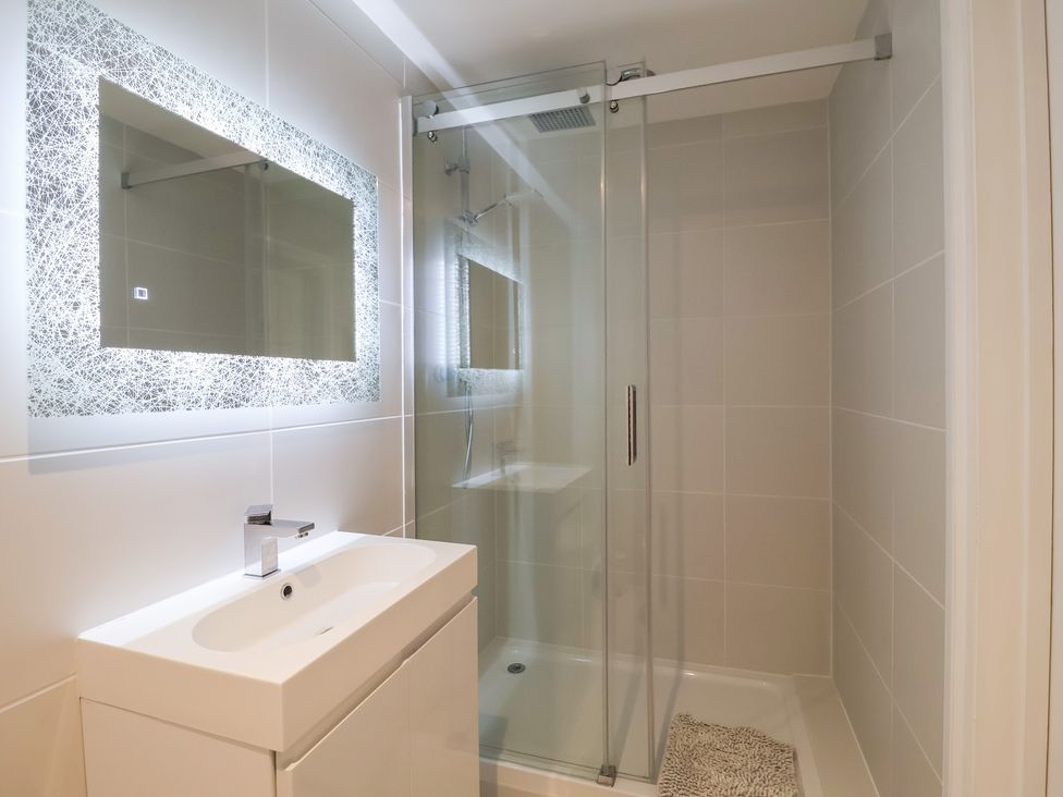 A bathroom with shower and sink at Three Ways in South Lopham near Garboldisham