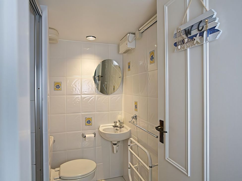 A bathroom with a sink and toilet at 4 Ringrone in Salcombe