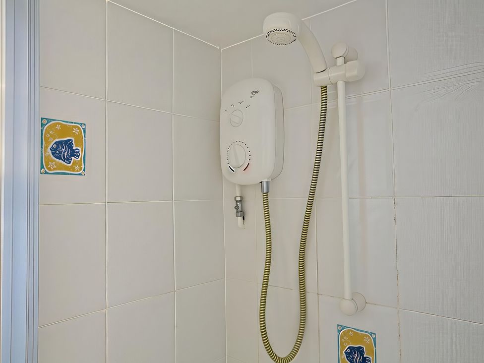 A shower with control unit and tiles at 4 Ringrone in Salcombe