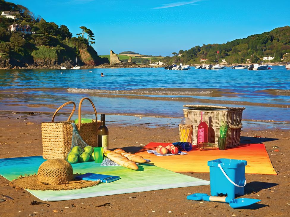 A beach picnic setup with food and drinks at 4 Ringrone, Salcombe