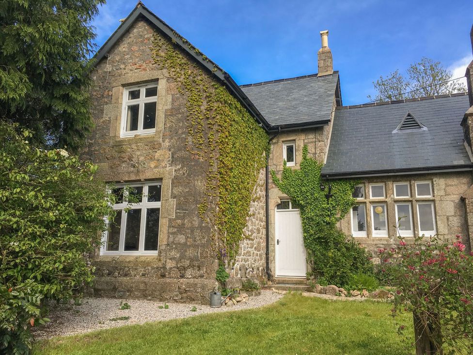 A house with ivy and garden at School House in Ivybridge