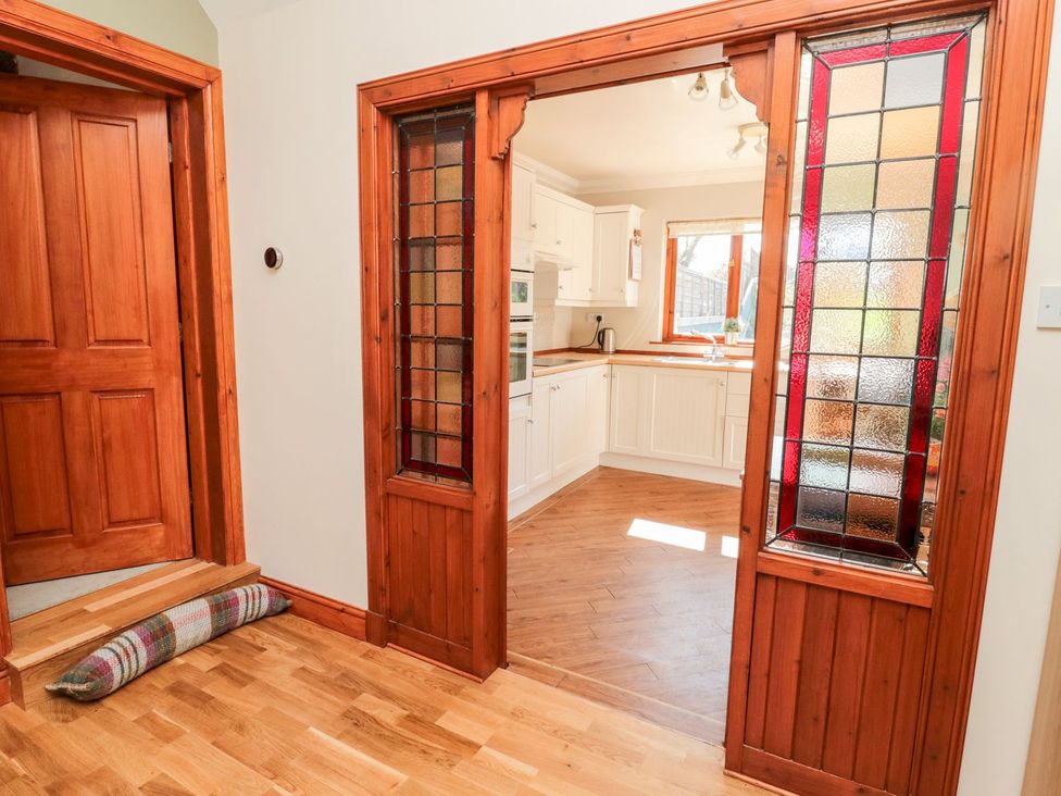 A view of a kitchen from a hallway at Cygnet Cottage Berwick-upon-Tweed