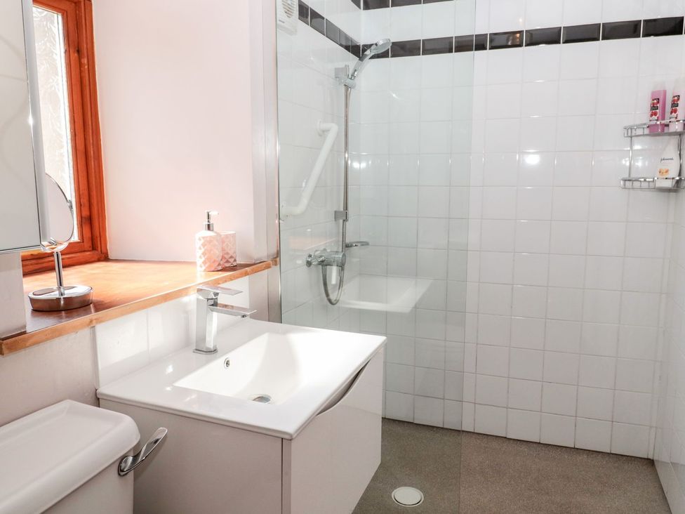 A bathroom with a sink and shower at Cygnet Cottage Berwick-upon-Tweed