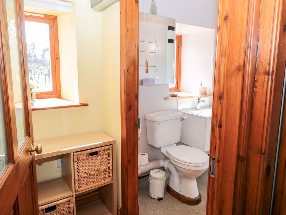 A bathroom with a toilet and sink at Cygnet Cottage Berwick-upon-Tweed