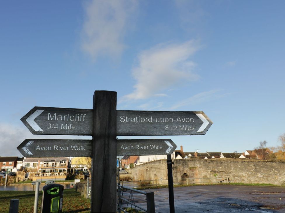 A signpost indicating directions to Marlcliff and Stratford-upon-Avon