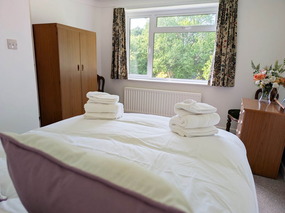 A bedroom with a bed and a window at Roslyn in Romsey