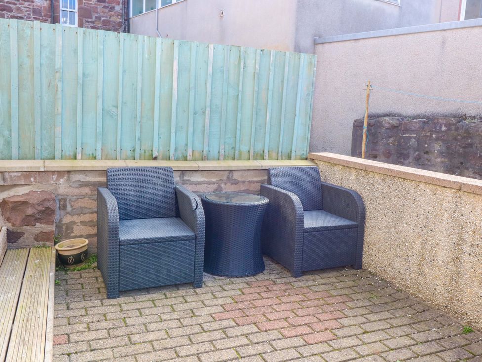 Two chairs and a table in a garden at The Harbour Hoose Stonehaven