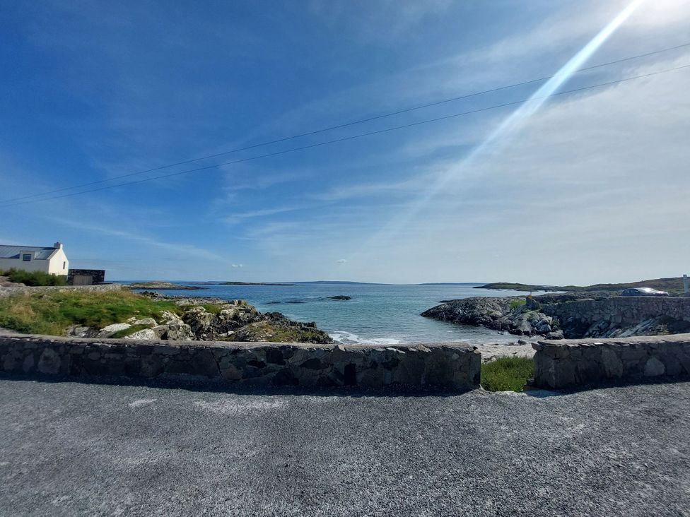 A view of the sea with a house in the background at Tigh Marie 