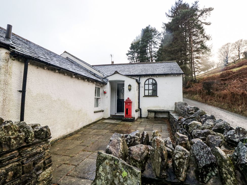 An exterior view of a house with a post box and pathway at Newlands Fell House near Keswick