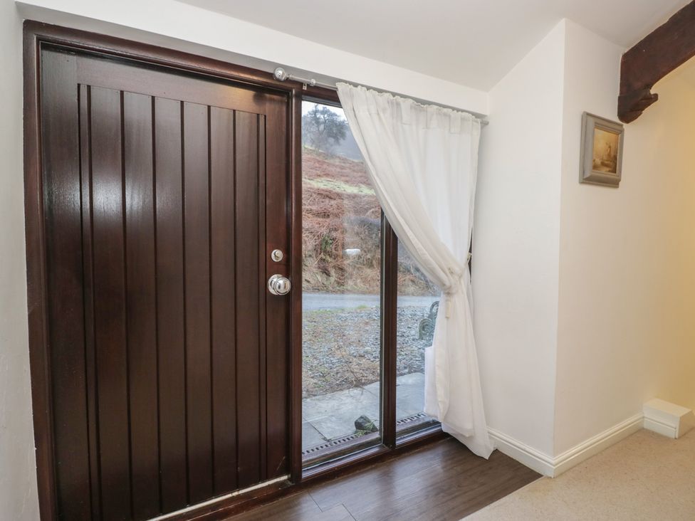 An entrance with a front door and window at Newlands Fell House in Newlands near Keswick