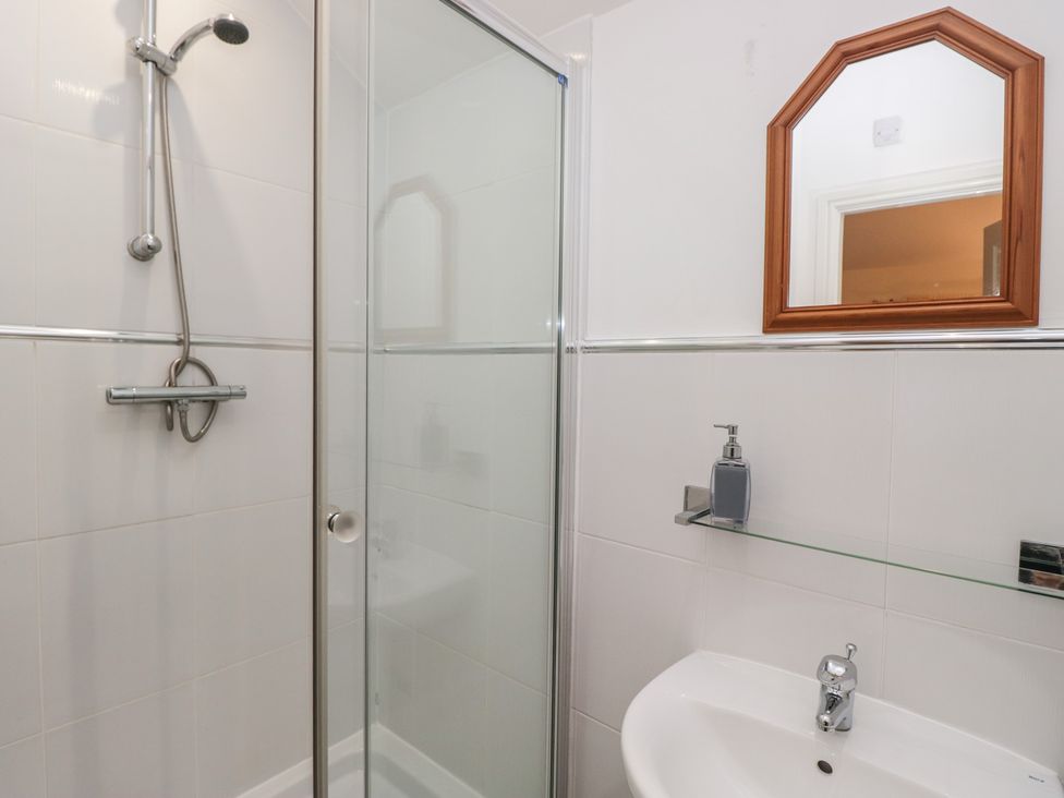 A bathroom with a shower and sink at Newlands Fell House in Newlands near Keswick