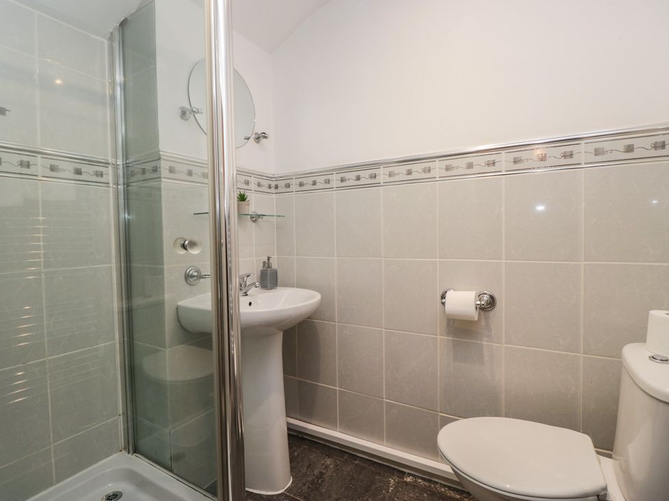 A bathroom with shower and sink at Newlands Fell House in Newlands near Keswick