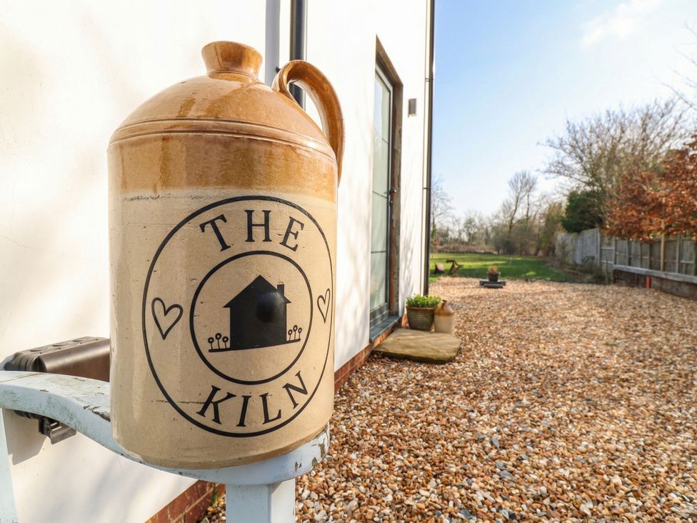 A water jug with the name The Kiln in an outdoor area at The Kiln Colmworth