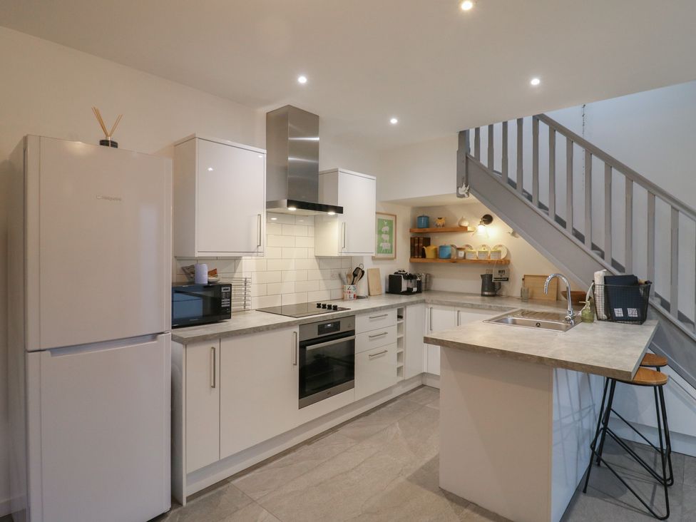 A kitchen with appliances and counter space at The Kiln in Colmworth