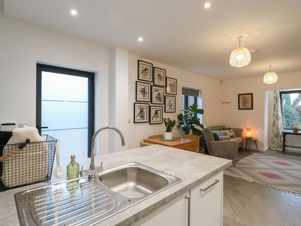 A kitchen with a sink and window at The Kiln in Colmworth