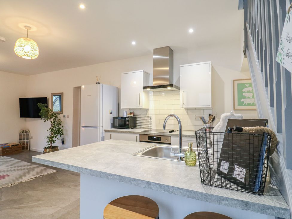 A kitchen with a countertop and appliances at The Kiln in Colmworth