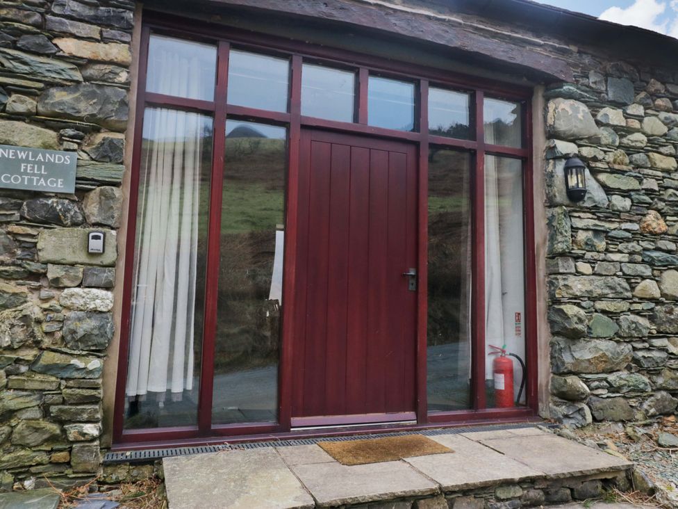 An entrance with a door and window at Newlands Fell Cottage near Keswick