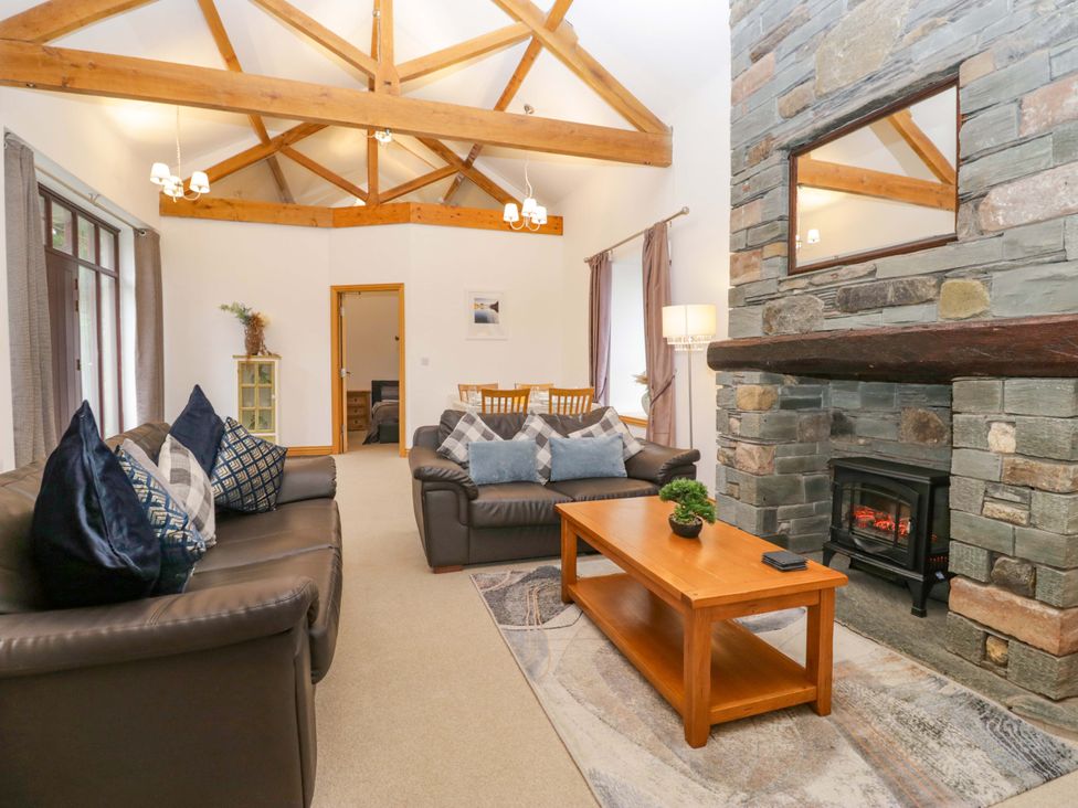 A living room with a sofa and coffee table at Newlands Fell Cottage in Newlands near Keswick