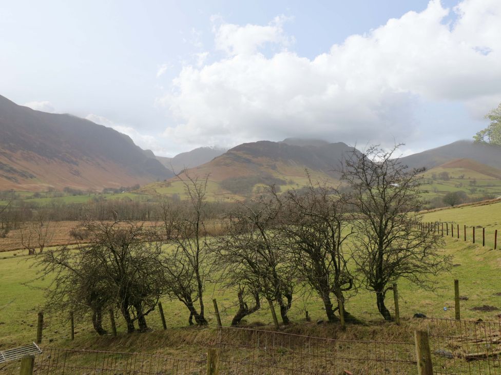 A landscape with mountains and trees at Newlands Fell Cottage in Newlands near Keswick