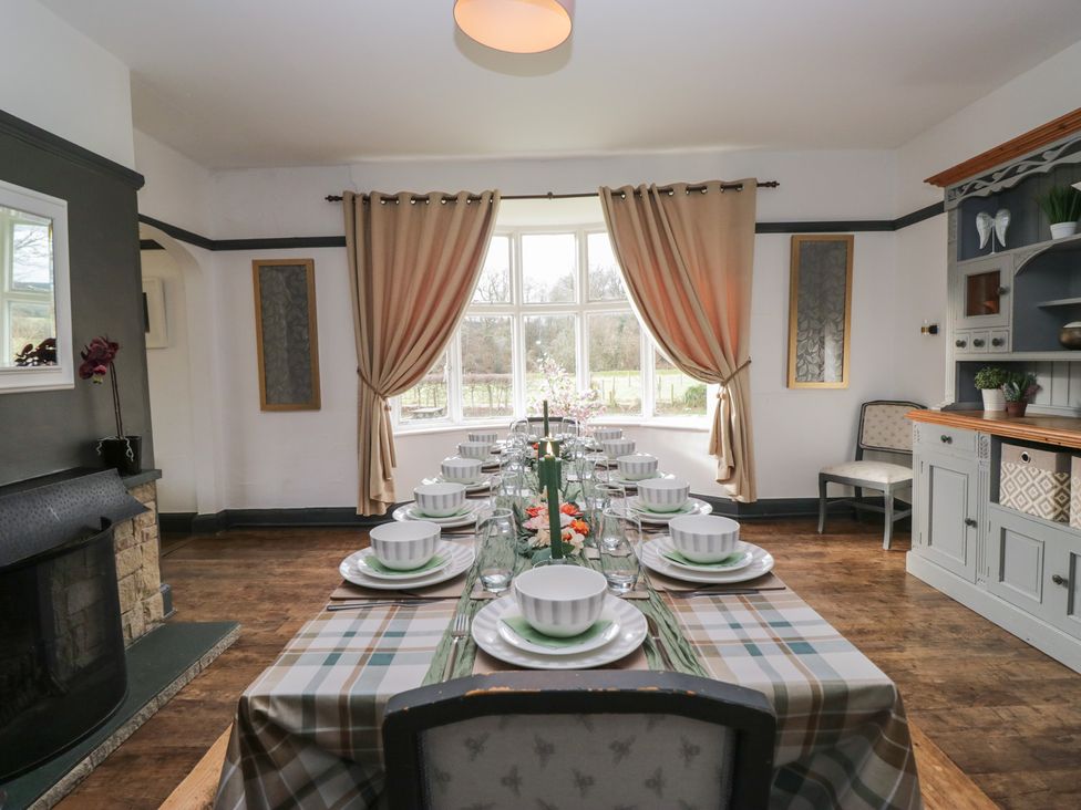 A dining room with a table set for a meal at Herdwick Croft in Bassenthwaite