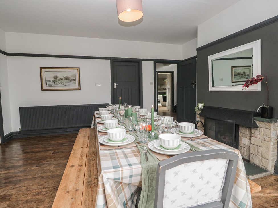 A dining room with a table set for a meal at Herdwick Croft in Bassenthwaite