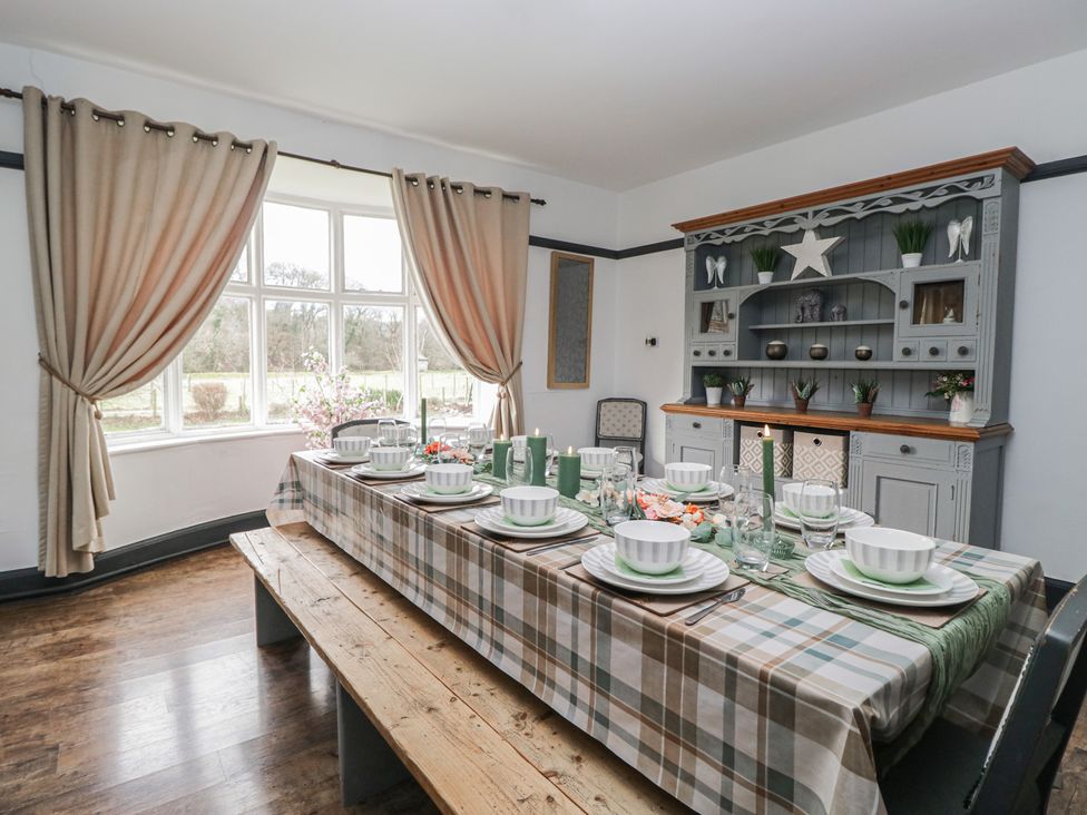 A dining room with a table set for a meal at Herdwick Croft in Bassenthwaite