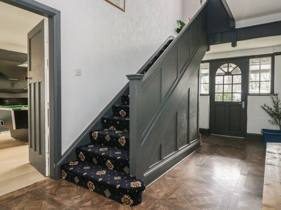 A staircase leading to the upper floor in the hallway at Herdwick Croft in Bassenthwaite