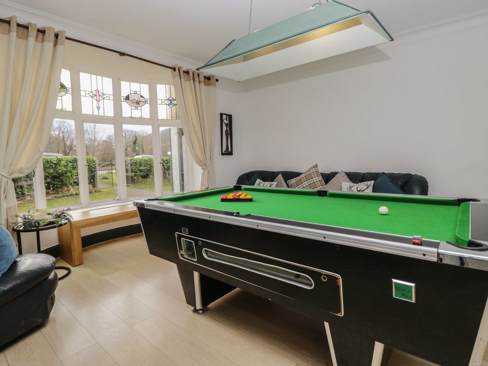 A game room with a pool table and a sofa at Herdwick Croft in Bassenthwaite