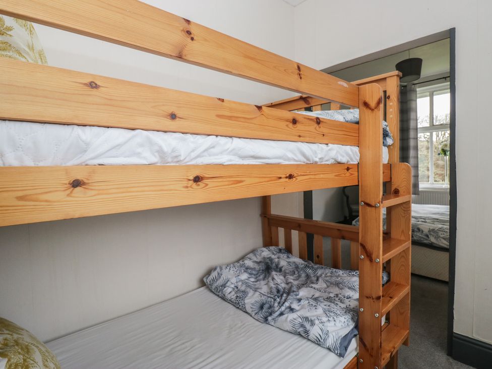 A bunk bed with bedding in a bedroom at Herdwick Croft in Bassenthwaite