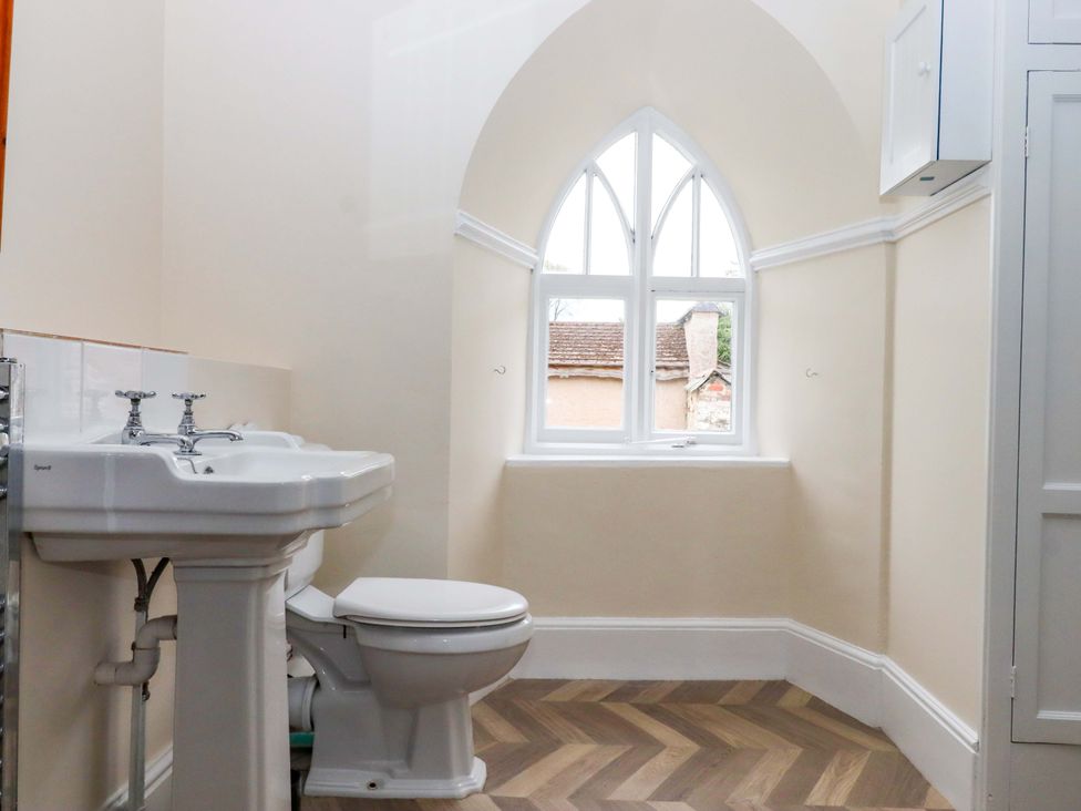 A bathroom with a sink and toilet at Dowrich West Wing Apartment in Crediton