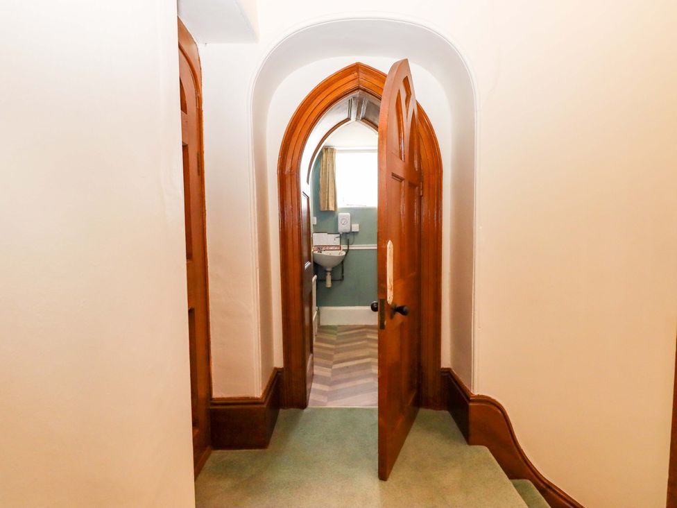 A bathroom with a toilet and sink at Dowrich West Wing Apartment in Crediton