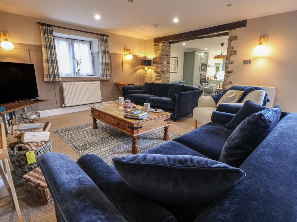 A living room with sofas and a coffee table at The Forge in Castleton, Peak District