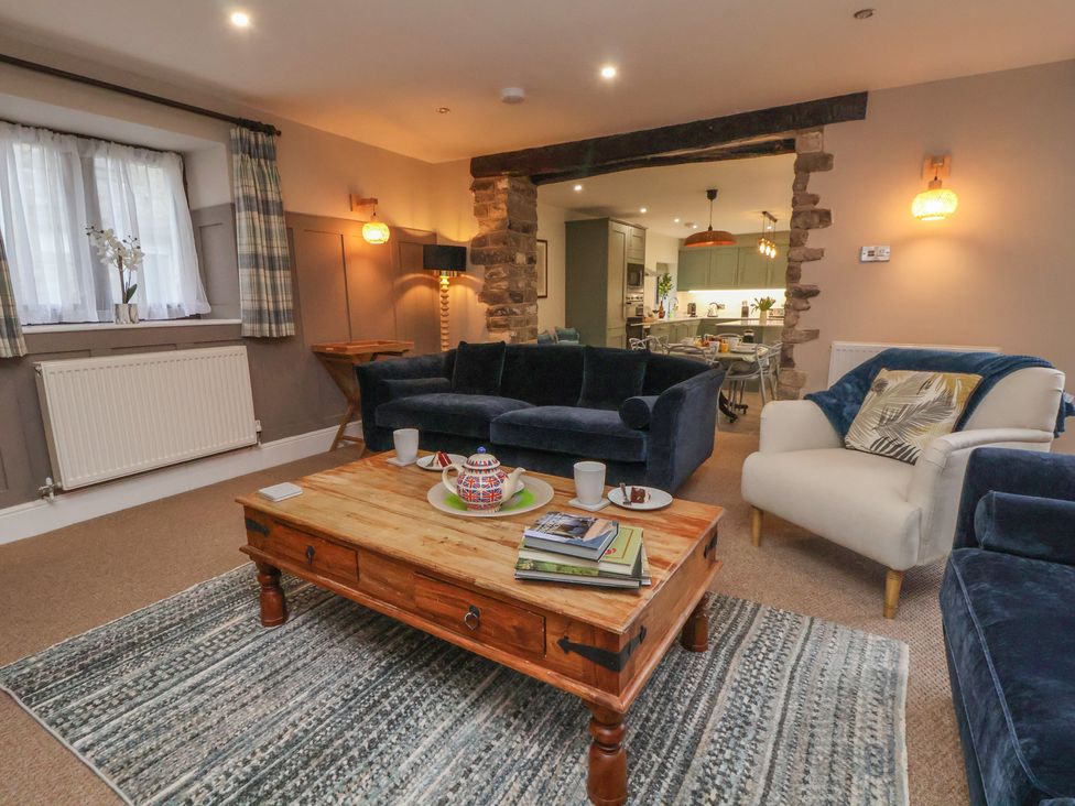 A living room with seating and a coffee table at The Forge in Castleton, Peak District